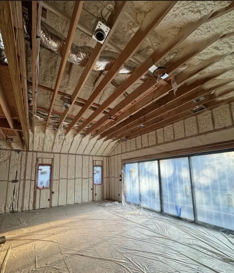 Interior walls and ceiling insulated with spray foam during new construction in Alton